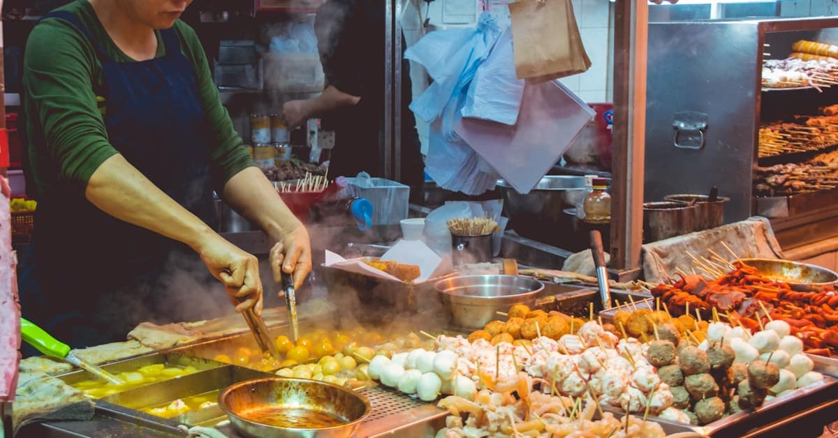 xian muslim quarter - street food vendors cooking at night market stalls