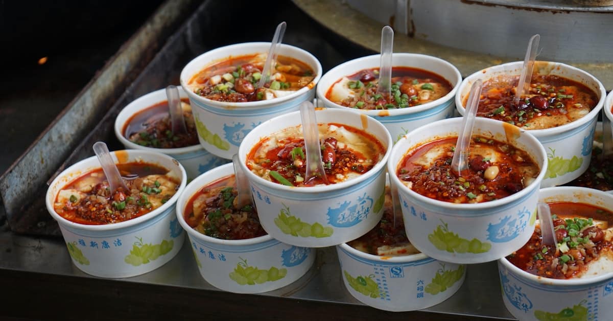 Chinese regional food bowls on a table