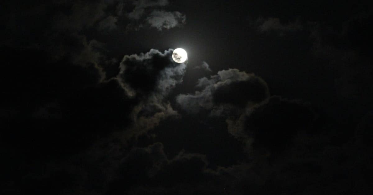 mid-autumn festival china - full moon over traditional rooftops