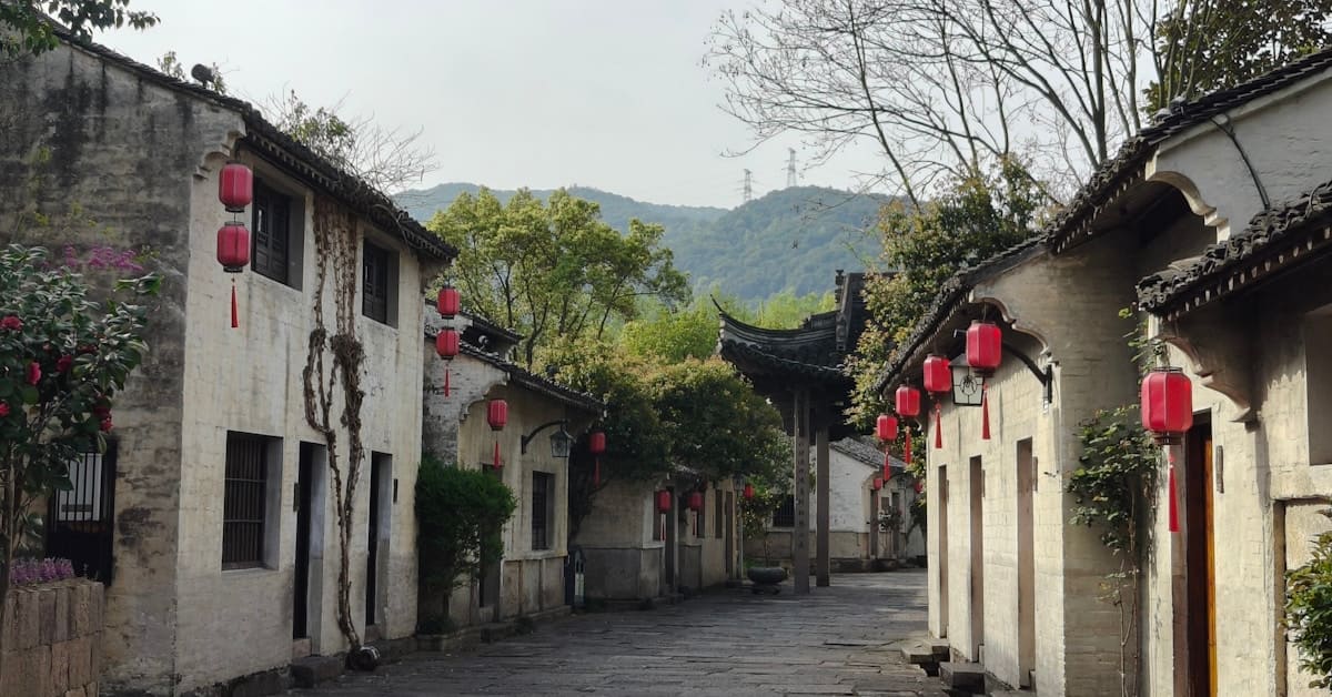 lijiang old town - traditional street with red lanterns and cobblestones