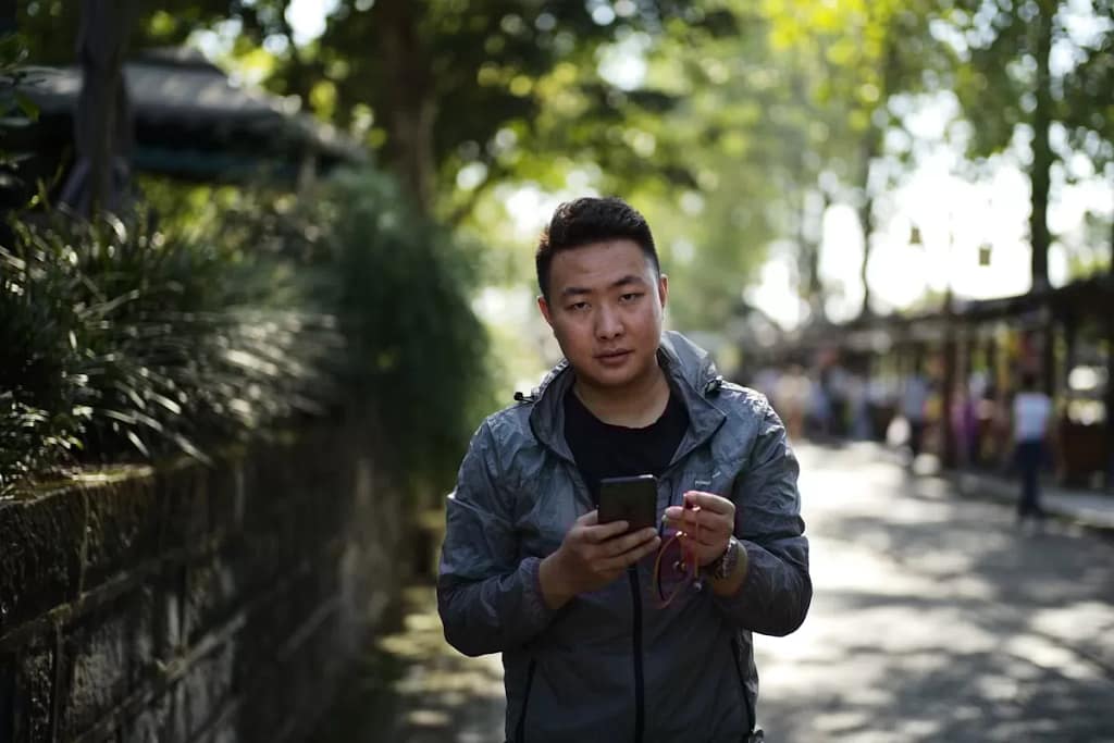 Traveler scanning QR code with smartphone
