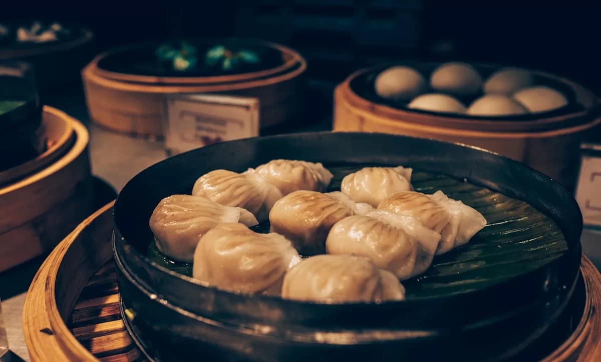 A diverse spread of classic Chinese dishes including dumplings and stir-fries