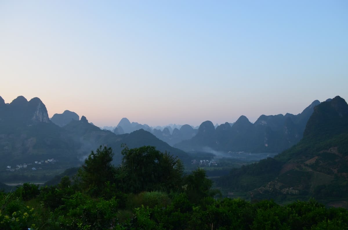 Misty karst mountain peaks in Yangshuo countryside near Guilin China