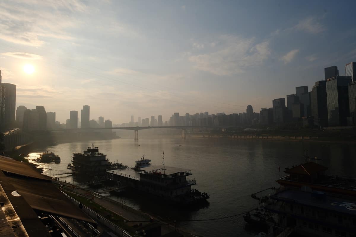 Dramatic bridge crossing the Yangtze River in Chongqing with city skyline backdrop China
