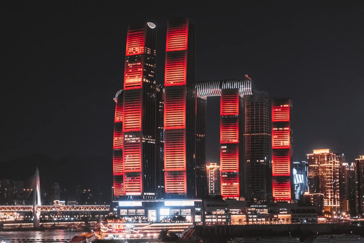Futuristic neon-lit skyscrapers and elevated walkways in Chongqing at night China