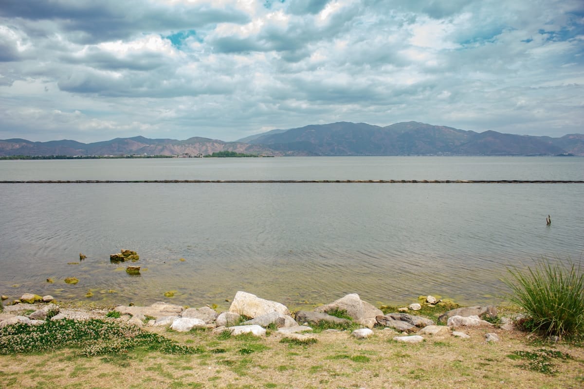 Scenic Erhai Lake with mountains at sunset near Dali Yunnan China
