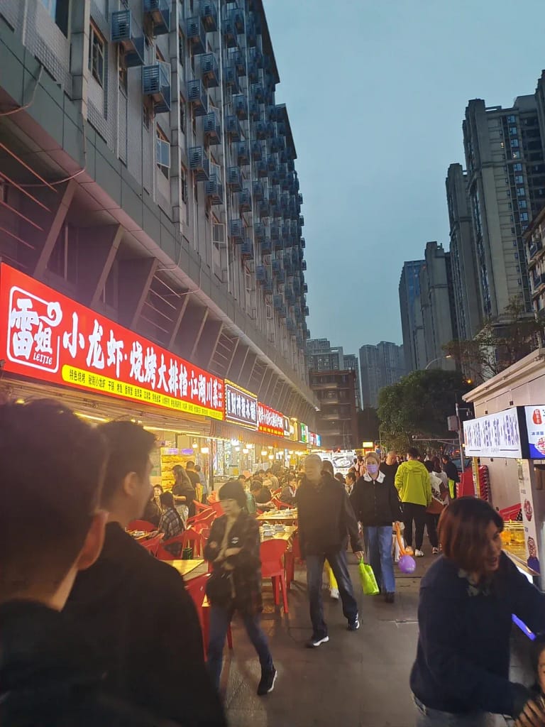 Chengdu snack street stalls with WeChat Pay and Alipay QR codes