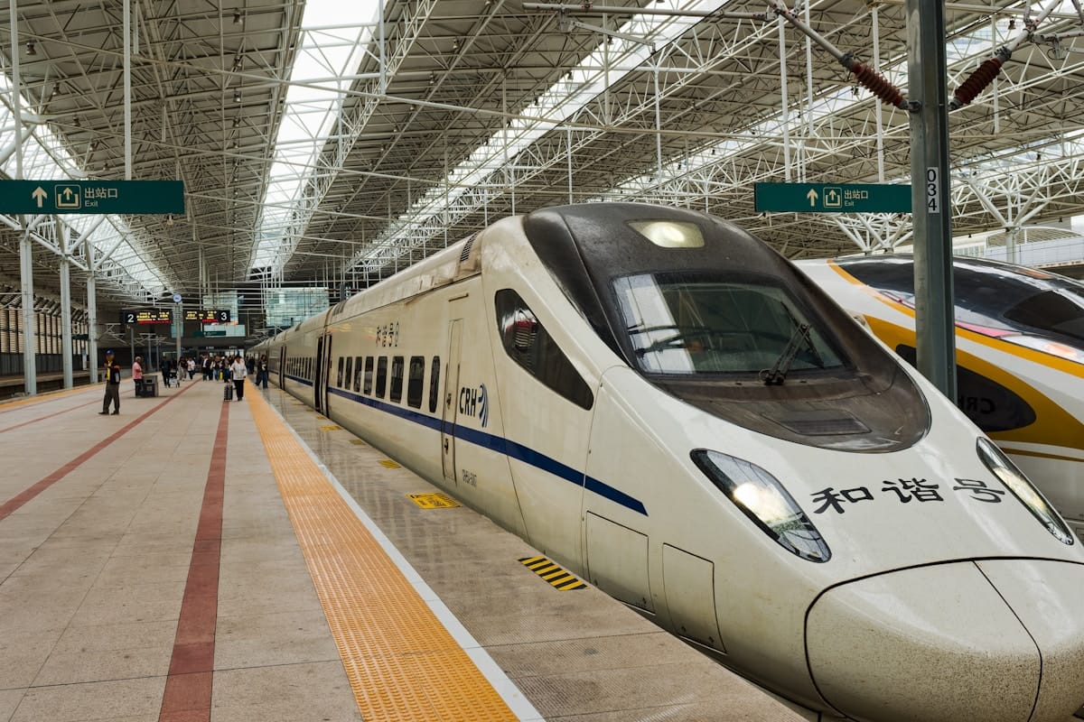 china summer travel - high speed train at the station platform in the early morning