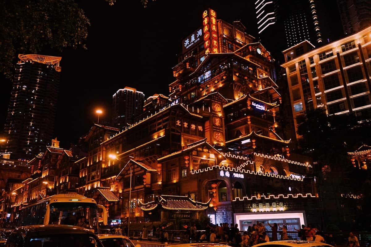 didi maps china - chongqing hilly street at night with neon signs