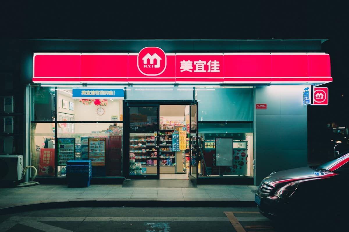 noodle counter china - convenience store at night charging phone power bank