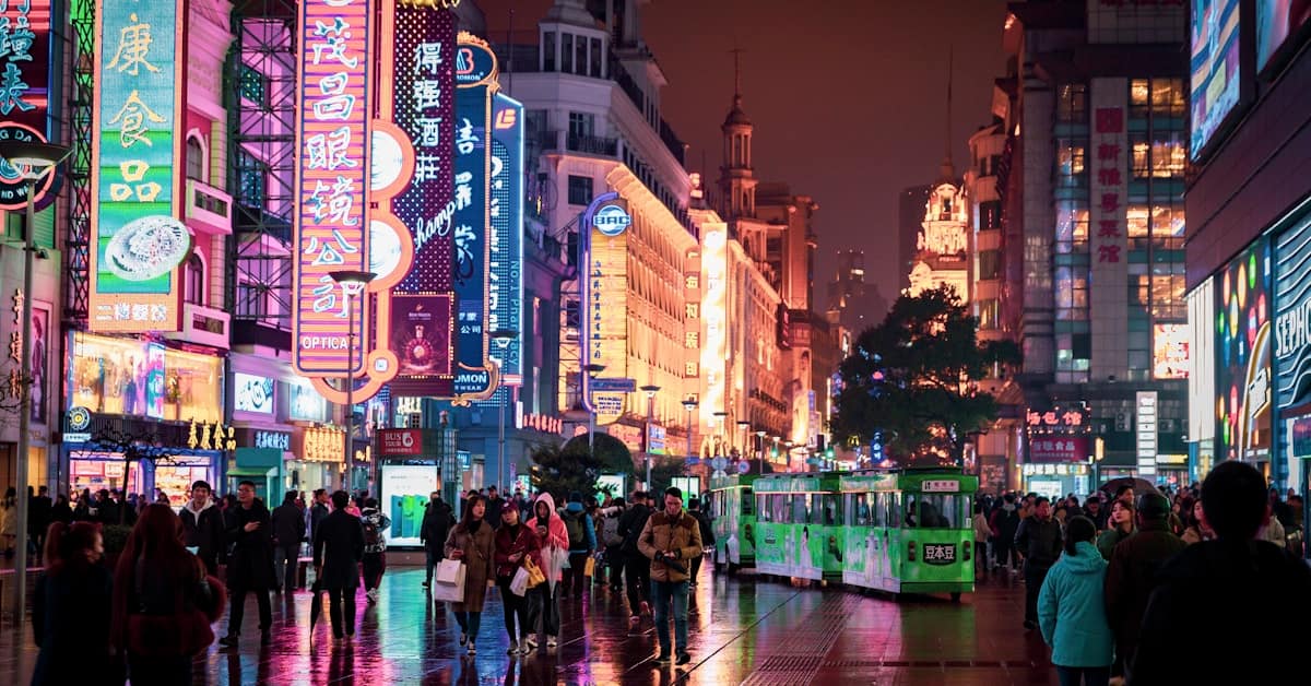is china safe at night - people walking on city street at night