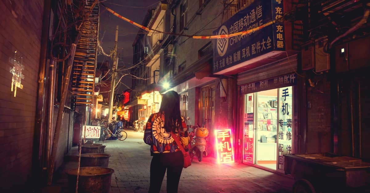 is china safe at night - woman standing on city street at night