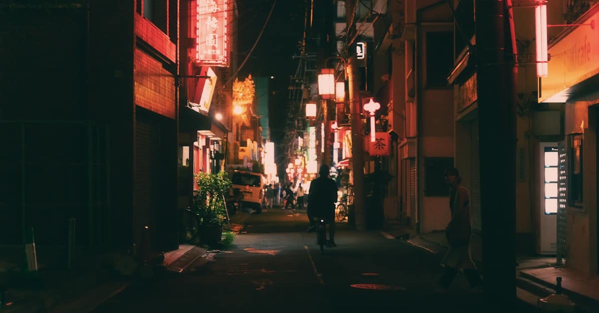 is china safe at night - man walking alone on street at night