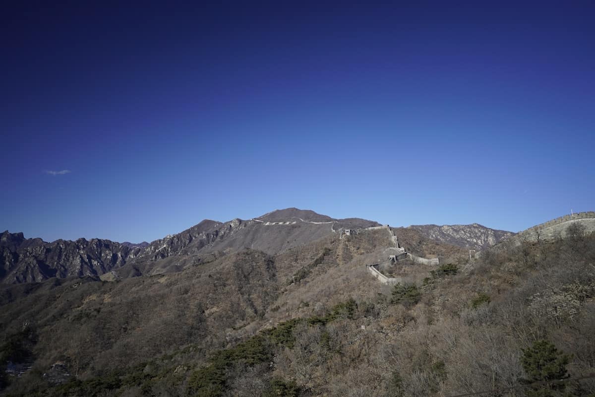 visiting great wall - the wall disappearing over ridges far into the distance
