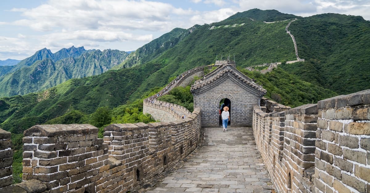 great wall china - woman walking on the Mutianyu section during daytime