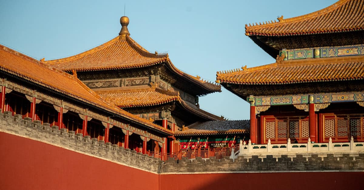forbidden city beijing - red and gold imperial hall of the Forbidden City under blue sky