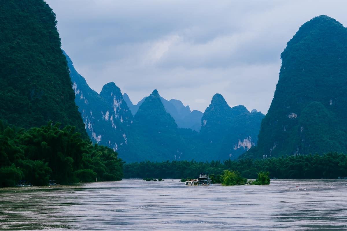 china in august - Guilin Li River with karst mountains and a boat