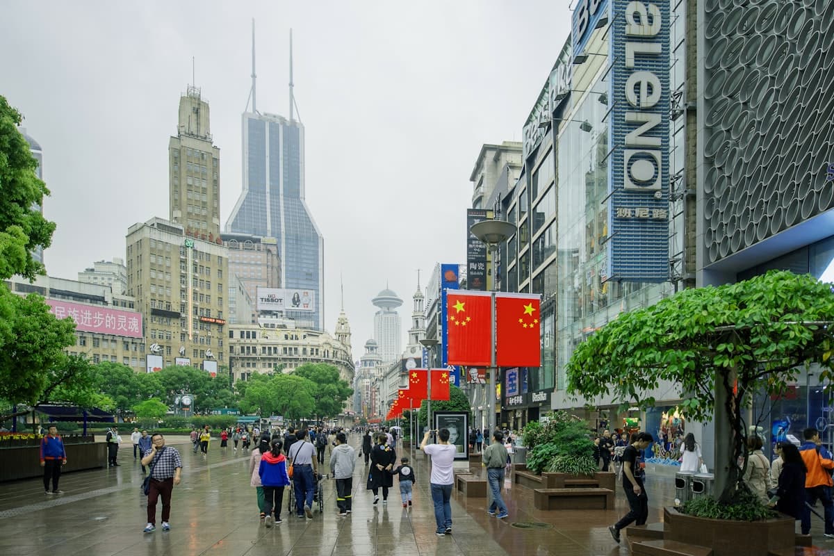 china in august - Shanghai street with people walking in summer rain