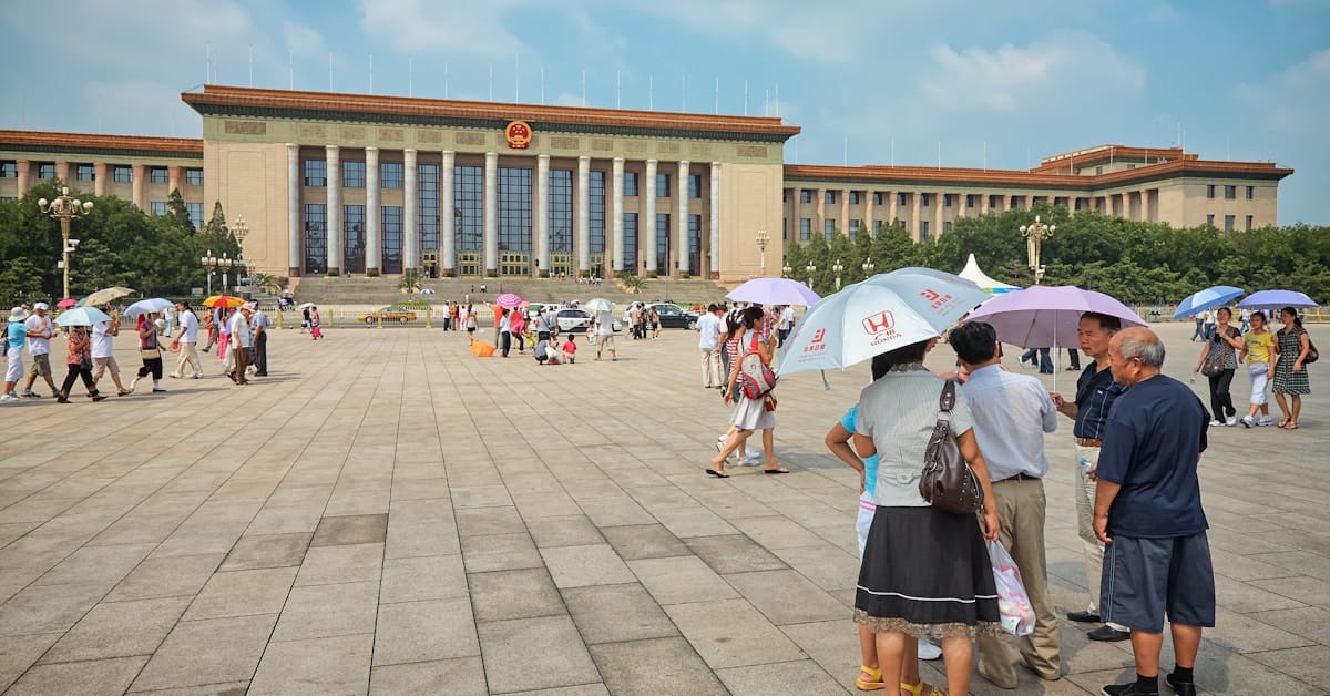china in july - pedestrians navigating a hot city street during summer