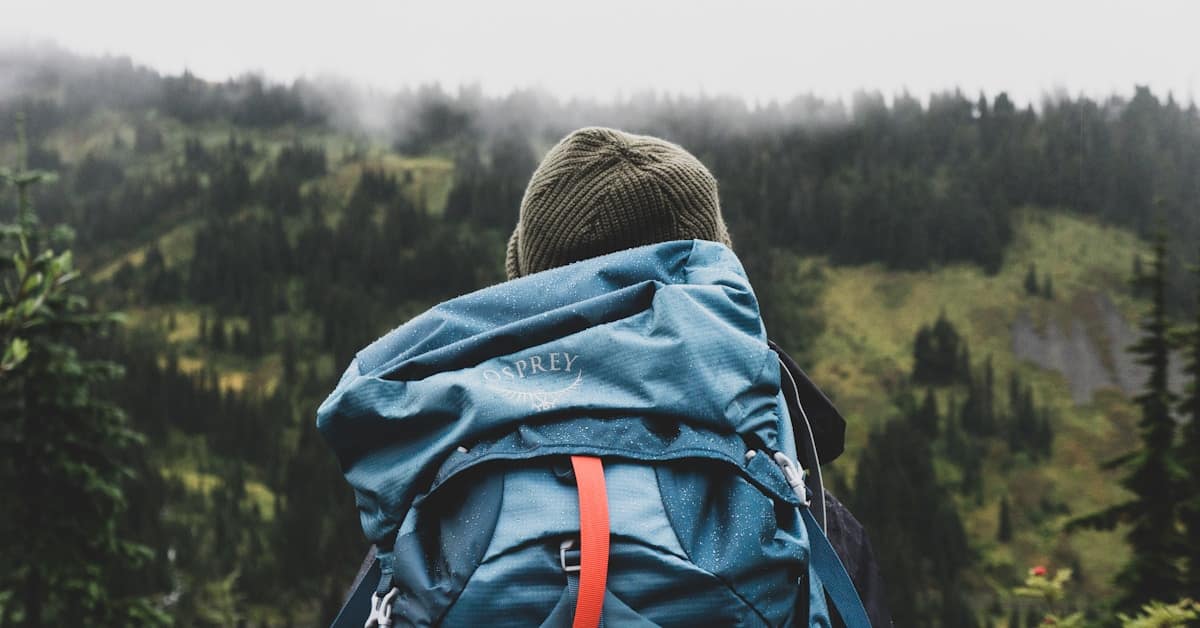 china packing list - traveler with backpack overlooking mountains