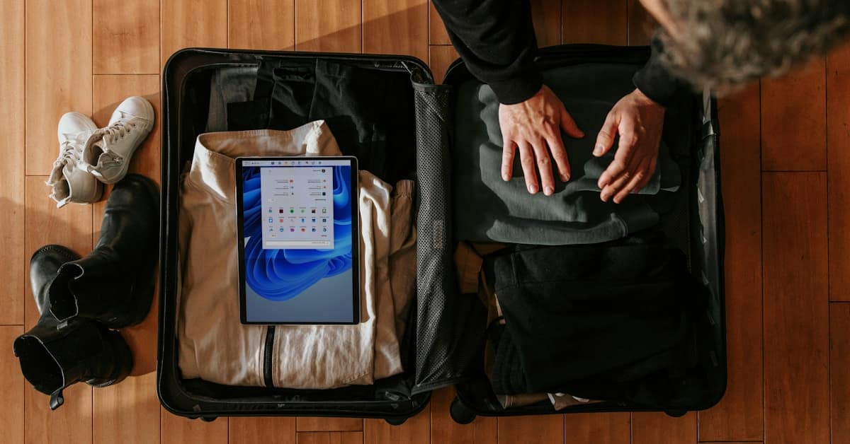 china packing list - overhead view of traveler packing a suitcase