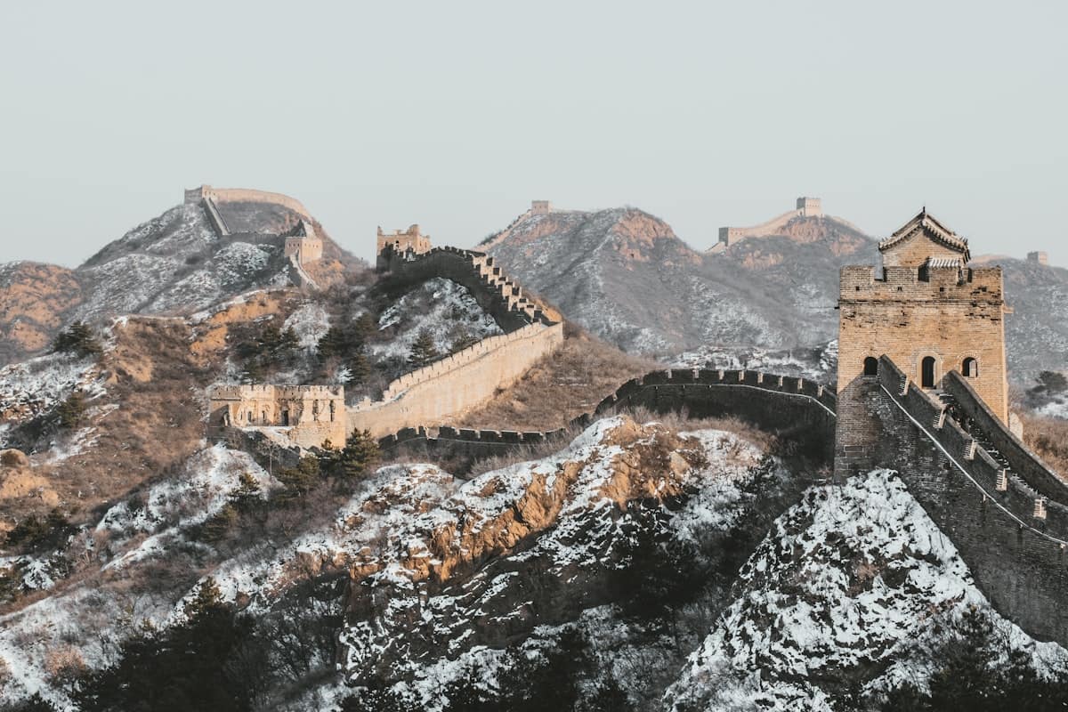 china in december - great wall of china covered in snow winter
